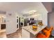 Modern kitchen featuring granite countertops, stainless steel appliances, and barstool seating at 836 S Vance St # D, Lakewood, CO 80226