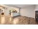 Open-concept living area with modern floors and a view to the adjacent kitchen at 836 S Vance St # D, Lakewood, CO 80226