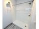 Updated bathroom features a walk-in shower with white subway tile and modern fixtures at 4760 S Wadsworth Blvd # F105, Littleton, CO 80123