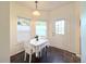 Bright breakfast nook with natural light from the windows creates an inviting atmosphere at 4760 S Wadsworth Blvd # F105, Littleton, CO 80123