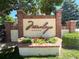 Decorative brick and stucco sign that reads 