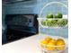 Close-up of a kitchen with modern countertops, appliances, and colorful accents at 4760 S Wadsworth Blvd # F105, Littleton, CO 80123