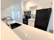 Bright kitchen with white countertops, stylish backsplash, and new appliances at 4760 S Wadsworth Blvd # F105, Littleton, CO 80123
