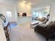 Open-concept living room with a fireplace creates a warm and inviting space for gatherings at 4760 S Wadsworth Blvd # F105, Littleton, CO 80123