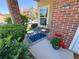 Charming patio with table and chairs, potted flowers, and attractive landscaping at 4760 S Wadsworth Blvd # F105, Littleton, CO 80123