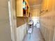 Unfinished storage room with cabinets, peg board and supplies at 4760 S Wadsworth Blvd # F105, Littleton, CO 80123