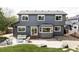 Beautiful backyard view featuring a patio, seating area, and well-manicured lawn at 6123 Dunraven Rd, Golden, CO 80403