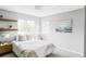 Cozy bedroom with a neutral color palette, natural light, and modern decor at 6123 Dunraven Rd, Golden, CO 80403