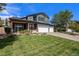 Beautiful two-story home featuring a covered porch and a spacious front yard at 6123 Dunraven Rd, Golden, CO 80403