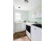 Well-lit laundry room equipped with a washer, dryer, and ample storage space at 6123 Dunraven Rd, Golden, CO 80403