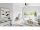 Well-lit main bedroom with vaulted ceilings, fan, and a view of the neighborhood at 6123 Dunraven Rd, Golden, CO 80403