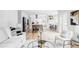 Open floor plan featuring a spacious living area, modern kitchen, and bright dining space at 6123 Dunraven Rd, Golden, CO 80403