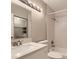 Clean bathroom offers modern vanity, shower and tub, and adjacent laundry space at 18043 E Ohio Ave # 202, Aurora, CO 80017