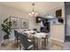 Dining room with a marble table and chandelier lighting at 18043 E Ohio Ave # 202, Aurora, CO 80017