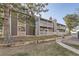 Charming condo featuring stone accents, private balconies, and mature trees at 18043 E Ohio Ave # 202, Aurora, CO 80017