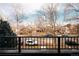 Street view from the balcony showing street-side parking, brick homes, and bare trees at 2751 Curtis St, Denver, CO 80205