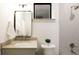 Nicely renovated bathroom with shower, toilet and vanity with sink at 2751 Curtis St, Denver, CO 80205
