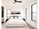 Bright bedroom with modern black trim windows, mountain wall art, and en-suite bathroom at 2751 Curtis St, Denver, CO 80205