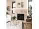 Spacious living room with a fireplace, contemporary decor, and plenty of natural light at 2751 Curtis St, Denver, CO 80205