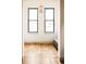 Bright living space featuring herringbone floors, modern lighting, and large windows at 2751 Curtis St, Denver, CO 80205
