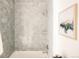Nicely tiled walk-in shower with a showerhead and a built-in shelf at 2751 Curtis St, Denver, CO 80205