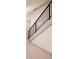 Carpeted staircase with black railing at 2751 Curtis St, Denver, CO 80205