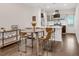 Open-concept kitchen with stainless steel appliances and a dining area at 2707 Decatur St, Denver, CO 80211