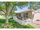 Well-manicured backyard with a white picket fence and lush green grass at 8951 Greenwich St, Highlands Ranch, CO 80130