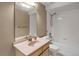 Bathroom with a vanity, sink, and shower-tub combination at 8951 Greenwich St, Highlands Ranch, CO 80130