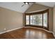 A bedroom featuring vaulted ceilings, hardwood floors, and large bay window at 8951 Greenwich St, Highlands Ranch, CO 80130