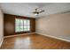 Bedroom boasts hardwood floors and a window, blending comfort and style at 8951 Greenwich St, Highlands Ranch, CO 80130
