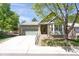 Charming single-story home with well-maintained lawn and attached two-car garage at 8951 Greenwich St, Highlands Ranch, CO 80130