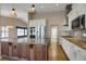 Modern kitchen featuring a center island, stainless appliances, custom cabinets, and recessed lighting at 8951 Greenwich St, Highlands Ranch, CO 80130