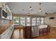 Beautiful kitchen with dark wood island, stainless steel appliances, and custom cabinets at 8951 Greenwich St, Highlands Ranch, CO 80130