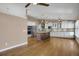 Spacious kitchen with a central island, stainless steel appliances, and hardwood flooring at 8951 Greenwich St, Highlands Ranch, CO 80130