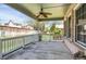 Spacious covered patio with a ceiling fan, perfect for outdoor entertaining at 8951 Greenwich St, Highlands Ranch, CO 80130