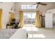 Bright bedroom features a balcony, fan, desk, and natural light at 2397 E Iliff Ave, Denver, CO 80210
