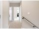 Hallway with carpet, doors, and neutral wall color at 2397 E Iliff Ave, Denver, CO 80210