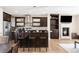 Modern kitchen featuring stainless steel appliances, a center island with seating, and a cozy fireplace at 2397 E Iliff Ave, Denver, CO 80210