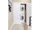 Laundry closet with stacked washer and dryer at 2397 E Iliff Ave, Denver, CO 80210