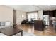 Open-concept living space with kitchen, dining area, and living room creates a seamless flow and inviting atmosphere at 2397 E Iliff Ave, Denver, CO 80210