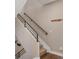Staircase with neutral carpet and modern railing at 2397 E Iliff Ave, Denver, CO 80210