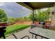 Relaxing backyard patio with comfortable seating, fire pit and a view of the green lawn at 10906 Touchstone Loop, Parker, CO 80134