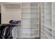 Spacious walk-in closet with custom shelving, plenty of room for clothes, and storage at 10906 Touchstone Loop, Parker, CO 80134