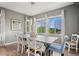 Dining room with large windows providing ample natural light at 10906 Touchstone Loop, Parker, CO 80134