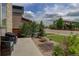 Landscaped front yard featuring decorative stone and mature plantings at 10906 Touchstone Loop, Parker, CO 80134