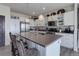 Modern kitchen featuring a large island with pendant lighting and bar seating at 10906 Touchstone Loop, Parker, CO 80134