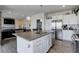 Open concept kitchen featuring stainless steel appliances and large island at 10906 Touchstone Loop, Parker, CO 80134