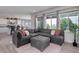 Comfortable living room with large sectional sofa, view of the kitchen and bright natural light at 10906 Touchstone Loop, Parker, CO 80134