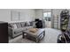 Bright living room with large, comfortable sofa and built in shelving at 10906 Touchstone Loop, Parker, CO 80134